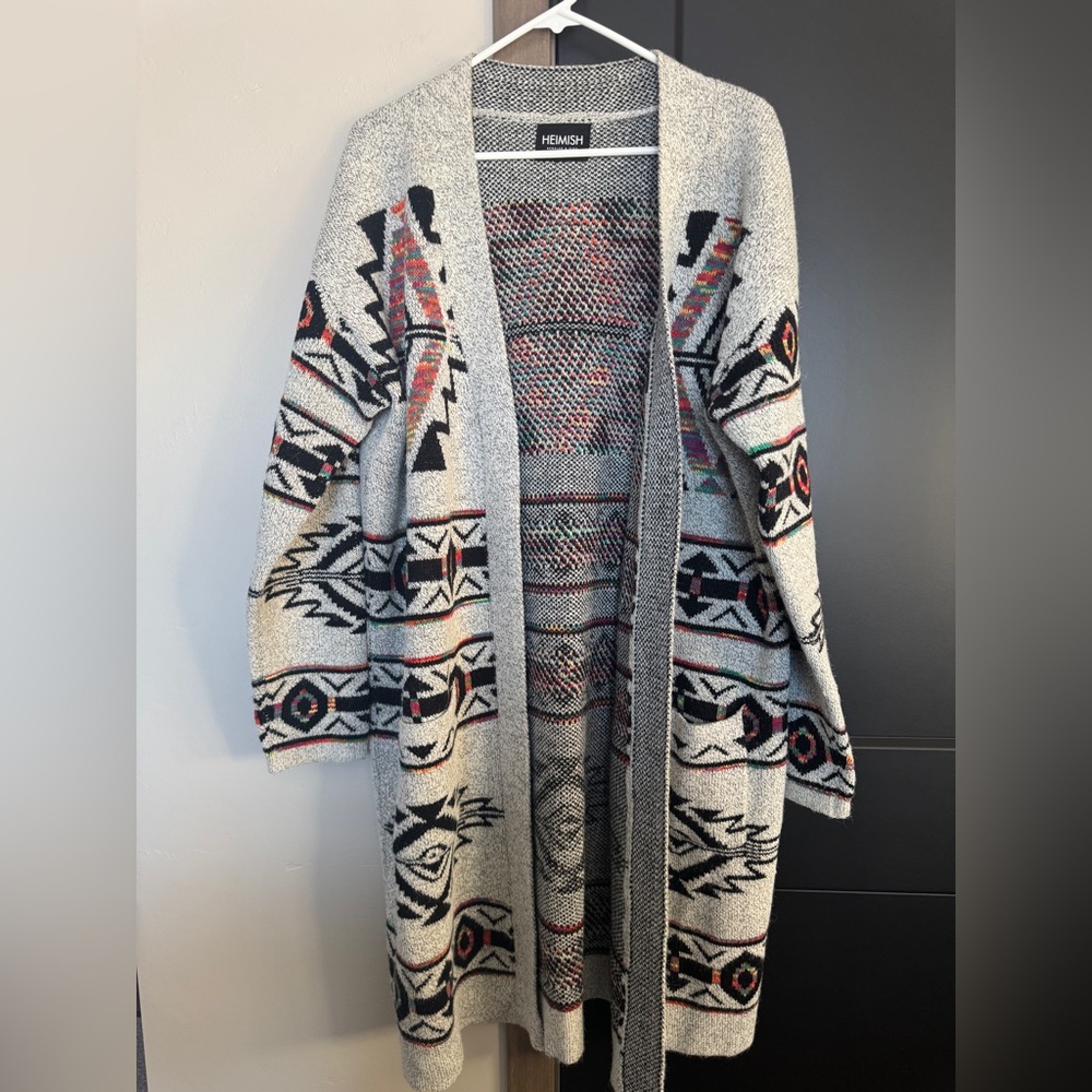 Long cardigan sweater in a colorful Aztec print.  Heimish brand, fits up to a 2X